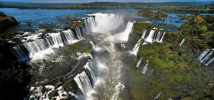 Enjoy an helicopter ride over the Iguazu Falls and see this immense complex of 275 falls in all their splendor