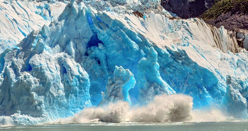 You may be lucky enough to see a gigantic chunk of ice falling from a glacier